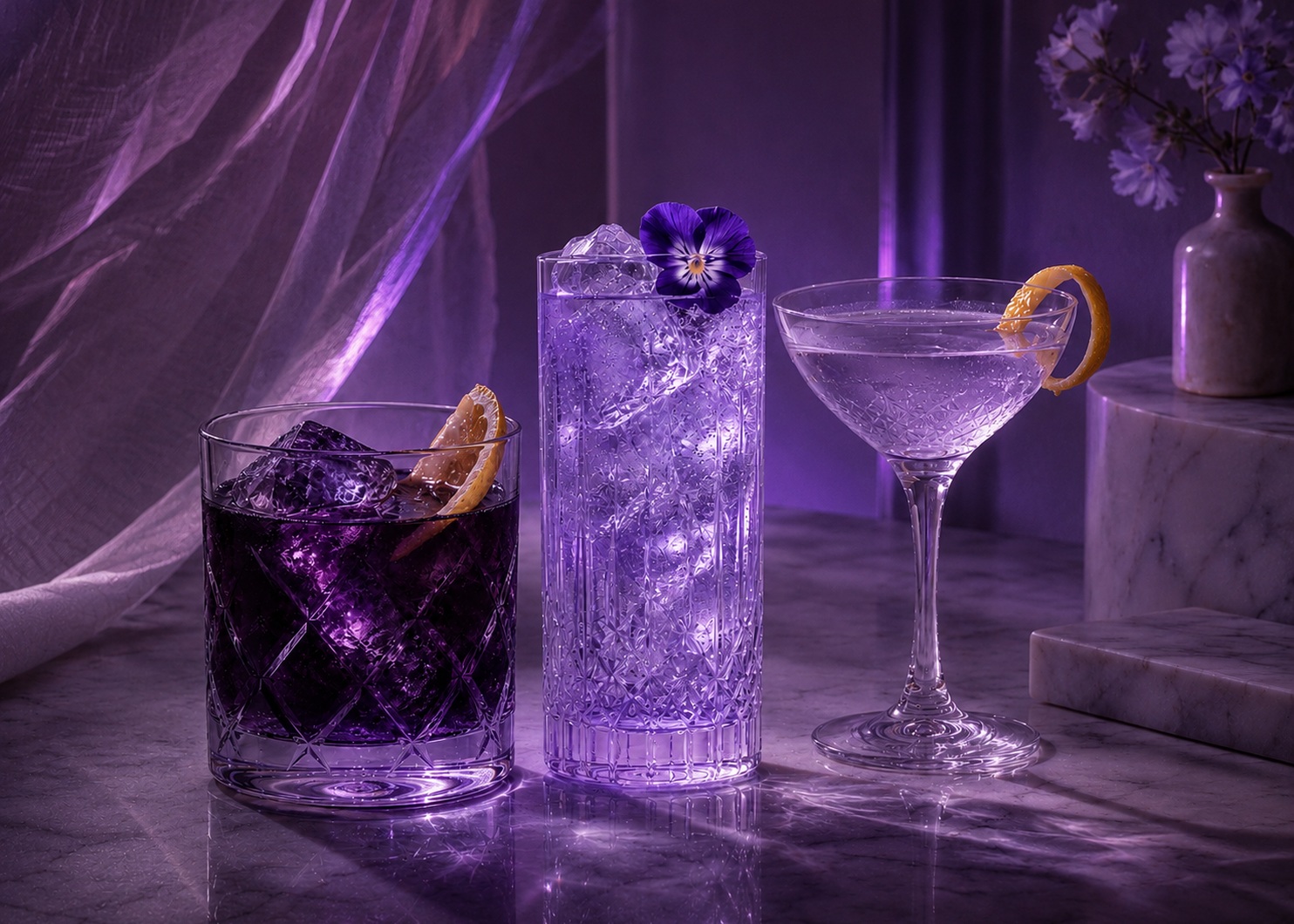 Three refined Livyatt cocktail serves lit by purple neon reflections at night
