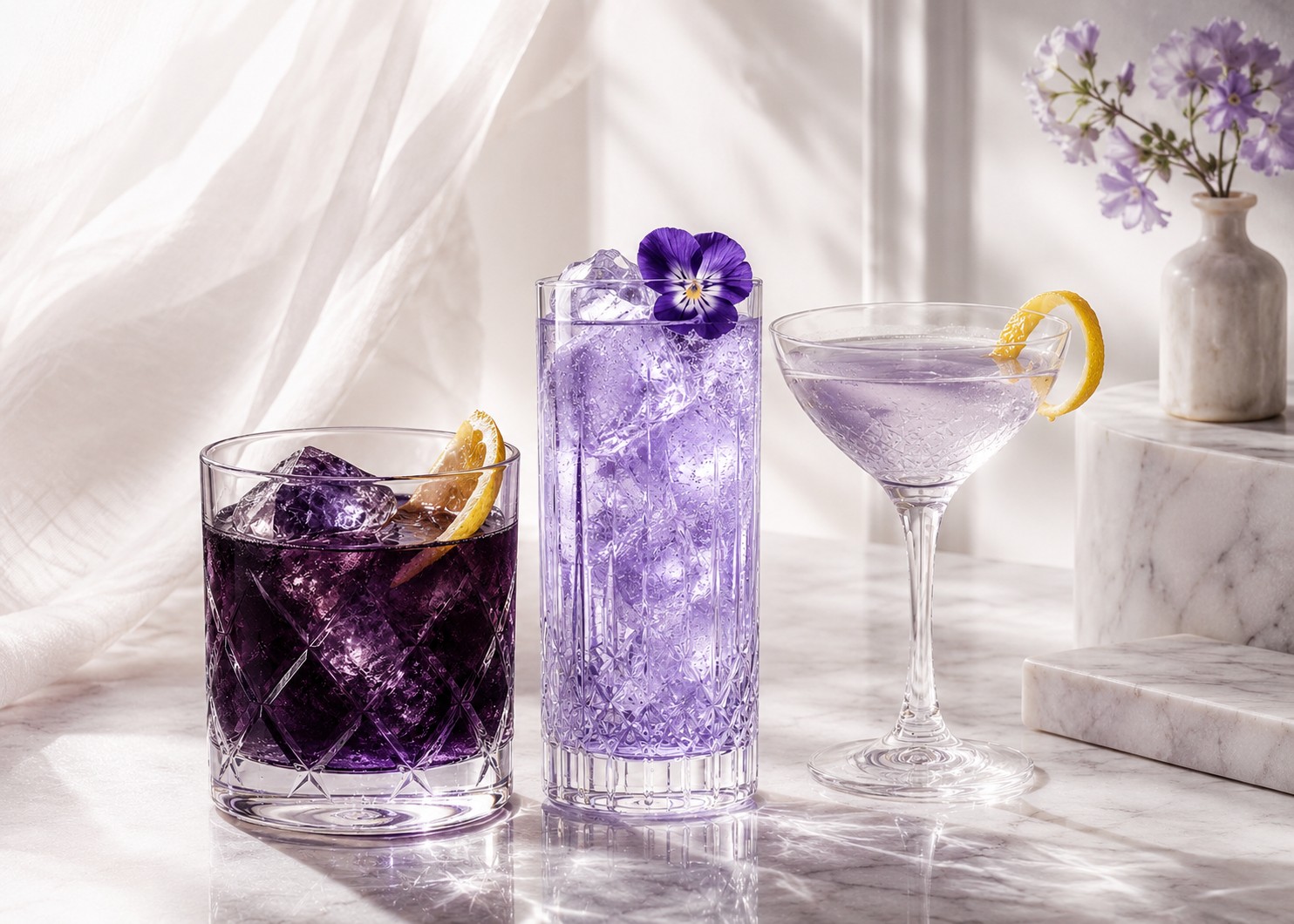 Three refined Livyatt cocktail serves in a bright daylight setting